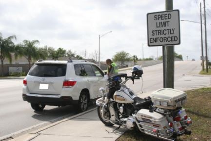 Motorcycle next to car
